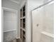 Bright bathroom featuring a large walk-in shower with seating and built in storage at 246 Gretna St, Port Charlotte, FL 33954