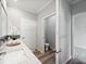 Bright bathroom features a white marble countertop and leads to a separate toilet room at 246 Gretna St, Port Charlotte, FL 33954