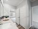 Bright bathroom features a white marble countertop and a door leading to the bedroom at 246 Gretna St, Port Charlotte, FL 33954