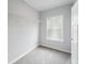 Bright closet with a gray carpet, a window and shelving at 246 Gretna St, Port Charlotte, FL 33954