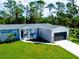 Charming home featuring a well manicured lawn and a two car garage at 246 Gretna St, Port Charlotte, FL 33954