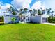 Charming single-story home featuring a well-manicured lawn and attached garage, perfect for suburban living at 246 Gretna St, Port Charlotte, FL 33954