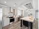 Modern kitchen boasts stainless steel appliances, grey cabinets, and an oversized island at 246 Gretna St, Port Charlotte, FL 33954