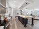 Modern kitchen with grey cabinets and large island overlooking living area at 246 Gretna St, Port Charlotte, FL 33954