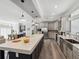 Modern kitchen boasts an oversized center island, stainless steel appliances and grey cabinets at 246 Gretna St, Port Charlotte, FL 33954