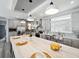 Modern kitchen boasts an oversized center island, stainless steel appliances and grey cabinets at 246 Gretna St, Port Charlotte, FL 33954