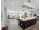 Open floor plan featuring a large center island, light grey walls and lots of natural light at 246 Gretna St, Port Charlotte, FL 33954