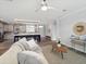 Spacious living room features modern furniture, light gray paint and an open floor plan with the kitchen at 246 Gretna St, Port Charlotte, FL 33954