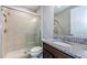 Bathroom boasts a glass-enclosed shower, granite countertop, and modern fixtures for a sleek look at 29038 Picana Ln, Wesley Chapel, FL 33543