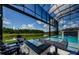 Beautiful outdoor space with a fire pit, spa, and relaxing lake views at 29038 Picana Ln, Wesley Chapel, FL 33543