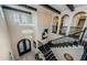 Expansive foyer featuring high ceilings, a statement chandelier, and a staircase with decorative iron railing at 29038 Picana Ln, Wesley Chapel, FL 33543