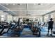 Community gym with modern equipment, large windows, ceiling fans and plenty of room for exercise at 29038 Picana Ln, Wesley Chapel, FL 33543
