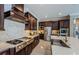 Modern kitchen with stainless steel appliances, a large island, custom cabinetry, and plenty of counter space at 29038 Picana Ln, Wesley Chapel, FL 33543