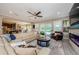 Bright living room showcasing a modern fireplace, comfortable seating, and seamless access to the outdoor pool area at 29038 Picana Ln, Wesley Chapel, FL 33543
