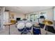 Open floor plan living space with a view to covered lanai and high ceilings at 29038 Picana Ln, Wesley Chapel, FL 33543