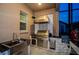 Well-equipped outdoor kitchen with a built-in sink and stainless-steel grill at 29038 Picana Ln, Wesley Chapel, FL 33543