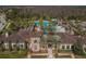 Aerial view of the pool and recreational area featuring a slide, lap pool, zero entry area, and abundant lounge seating at 29038 Picana Ln, Wesley Chapel, FL 33543