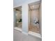 Modern bathroom with two tiled walk-in showers each with built-in bench seating at 29038 Picana Ln, Wesley Chapel, FL 33543