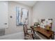 Cozy study area with decorative paintings and artwork, plus a writing desk at 29038 Picana Ln, Wesley Chapel, FL 33543