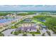 Beautiful aerial view of community amenities with pool, tennis courts, and more at 30326 Ceasar Park Dr, Wesley Chapel, FL 33543