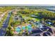 Wonderful aerial view of community amenities including pool, tennis, and basketball courts at 30326 Ceasar Park Dr, Wesley Chapel, FL 33543