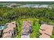 Aerial view of the home's roof, backyard, and surrounding neighborhood at 30326 Ceasar Park Dr, Wesley Chapel, FL 33543