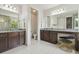Double vanity bathroom with granite countertops, a makeup vanity, and tile floors at 30326 Ceasar Park Dr, Wesley Chapel, FL 33543