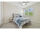 Bedroom with view of trees outside the window, and soft neutral tones at 30326 Ceasar Park Dr, Wesley Chapel, FL 33543