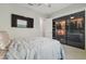 Comfortable bedroom with a large TV and a custom closet at 30326 Ceasar Park Dr, Wesley Chapel, FL 33543