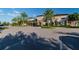 Community clubhouse with ample parking, mature landscaping, and architectural details at 30326 Ceasar Park Dr, Wesley Chapel, FL 33543