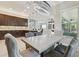 Open floor plan view of the dining room that features an eye-catching chandelier at 30326 Ceasar Park Dr, Wesley Chapel, FL 33543