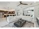 Spacious open-concept living area, seamlessly flowing into the gourmet kitchen and dining space at 30326 Ceasar Park Dr, Wesley Chapel, FL 33543