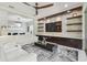 Open-concept living room with custom built-ins, recessed lighting, and stylish decor at 30326 Ceasar Park Dr, Wesley Chapel, FL 33543