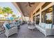 Relaxing covered patio with comfortable seating and serene views at 30326 Ceasar Park Dr, Wesley Chapel, FL 33543