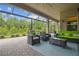 Covered patio with outdoor seating, a ceiling fan, and a view of the backyard at 30326 Ceasar Park Dr, Wesley Chapel, FL 33543