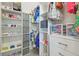 Organized walk-in closet with shelves, drawers, shoe racks, and clothing rods at 30326 Ceasar Park Dr, Wesley Chapel, FL 33543
