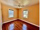 Bedroom with hardwood floors, white trim, neutral paint and bright windows at 3110 10Th N Ave, St Petersburg, FL 33713