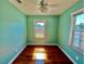 Cozy bedroom featuring a ceiling fan and a window letting in natural light with hardwood floors at 3110 10Th N Ave, St Petersburg, FL 33713