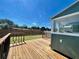 Well-maintained deck adjacent to a sunroom and fenced yard offering a peaceful outdoor space at 3110 10Th N Ave, St Petersburg, FL 33713