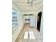 Eat-in kitchen with view to dining area, white fridge, and bright windows at 3110 10Th N Ave, St Petersburg, FL 33713