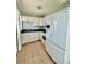 Compact kitchen with white appliances and cabinetry at 3110 10Th N Ave, St Petersburg, FL 33713