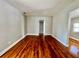 Spacious living room with hardwood flooring that complements the neutral wall color at 3110 10Th N Ave, St Petersburg, FL 33713