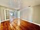 Bright living room featuring hardwood floors and French doors that create a transition to the next room at 3110 10Th N Ave, St Petersburg, FL 33713