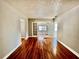 Elegant living room with hardwood floors and archways creates a warm and seamless transition between rooms at 3110 10Th N Ave, St Petersburg, FL 33713