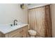 Bathroom features a sink with marble countertop, vanity and shower with curtain at 3262 Westcott Ct, Palm Harbor, FL 34684