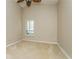 Bedroom features a vaulted ceiling, neutral carpet, and natural light from a window at 3262 Westcott Ct, Palm Harbor, FL 34684