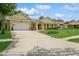 Charming single story home with a two car garage, manicured lawn, and beautiful landscaping at 3262 Westcott Ct, Palm Harbor, FL 34684