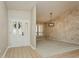 Bright foyer featuring tile flooring, neutral walls, and a decorative glass front door at 3262 Westcott Ct, Palm Harbor, FL 34684