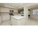 Bright kitchen with white cabinets, stainless steel appliances, and a center island at 3262 Westcott Ct, Palm Harbor, FL 34684