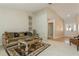 Comfortable living room with stylish decor, neutral walls, and tile entry at 3262 Westcott Ct, Palm Harbor, FL 34684